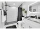 Contemporary bathroom featuring modern fixtures, a walk-in shower, and stylish vanity at 8010 W Hiawatha St, Tampa, FL 33615