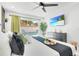 Relaxing bedroom with a pool view, contemporary furniture, and stylish interior design at 8010 W Hiawatha St, Tampa, FL 33615