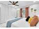 Bright bedroom with a window, large closet, and trendy decorations at 8010 W Hiawatha St, Tampa, FL 33615