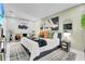 Inviting bedroom with king bed, sitting area, and modern decor for comfortable living at 8010 W Hiawatha St, Tampa, FL 33615