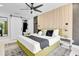 Stylish bedroom featuring a modern design with a barn door leading to the en-suite bath at 8010 W Hiawatha St, Tampa, FL 33615