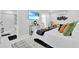Bright bedroom with a king bed, adjacent bathroom, and TV for ultimate relaxation at 8010 W Hiawatha St, Tampa, FL 33615