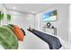 Bright bedroom with a king bed, closet and a TV with beach landscape for a calming setting at 8010 W Hiawatha St, Tampa, FL 33615