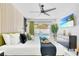 Bright, open bedroom with a serene view of the pool and stylish contemporary furnishings at 8010 W Hiawatha St, Tampa, FL 33615