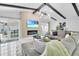 Bright living room features vaulted ceilings with exposed beams, stylish decor, and an electric fireplace at 8010 W Hiawatha St, Tampa, FL 33615