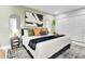 Spacious main bedroom with king bed, stylish decor, closet and modern fixtures at 8010 W Hiawatha St, Tampa, FL 33615