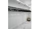 Well-organized walk-in closet with ample hanging space and marble floors at 8010 W Hiawatha St, Tampa, FL 33615