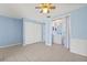 Bedroom featuring blue walls, a closet, and access to a bathroom at 8405 Woodbridge Blvd, Tampa, FL 33615