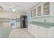 Well-appointed kitchen with stainless steel refrigerator and ample storage space at 8405 Woodbridge Blvd, Tampa, FL 33615