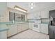 Updated kitchen featuring modern appliances and plenty of counter space at 8405 Woodbridge Blvd, Tampa, FL 33615