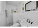 Quaint bathroom offering a walk-in shower with playful fish accents, and a pedestal sink at 8718 Tahiti Ln, Tampa, FL 33615