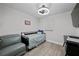 Cozy bedroom with a ceiling fan and ample natural light, creating a relaxing retreat at 8718 Tahiti Ln, Tampa, FL 33615