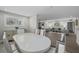 Spacious dining area open to the living room, featuring stylish furniture and bright natural light at 8718 Tahiti Ln, Tampa, FL 33615
