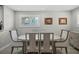 Elegant dining room featuring a modern table set, comfortable seating, and a large window at 8718 Tahiti Ln, Tampa, FL 33615