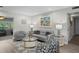 Comfortable living room with neutral tones, elegant decor, and ample seating, perfect for relaxation at 8718 Tahiti Ln, Tampa, FL 33615