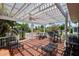 Spacious covered patio perfect for outdoor entertaining, offering water views and seating areas at 8718 Tahiti Ln, Tampa, FL 33615