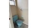 Bathroom area featuring a light blue toilet and towel rack at 8801 Orange Blossom Dr, Seminole, FL 33772