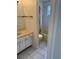 Bathroom with light yellow bathtub, shower and toilet, and a white cabinet at 8801 Orange Blossom Dr, Seminole, FL 33772