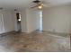 Spacious living room with ceiling fan, adjacent to the kitchen area for easy access at 8801 Orange Blossom Dr, Seminole, FL 33772