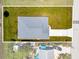 Overhead aerial view of property showing roof, driveway, and surrounding yard at 9073 Fruitland Ave, Englewood, FL 34224