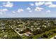 Beautiful aerial view of home in a quiet neighborhood and lush surroundings at 9073 Fruitland Ave, Englewood, FL 34224