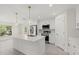 Kitchen featuring a white island, stainless steel appliances, and pendant lighting at 9073 Fruitland Ave, Englewood, FL 34224