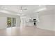 Open concept living and kitchen area featuring tile flooring and lots of natural light at 9073 Fruitland Ave, Englewood, FL 34224