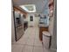 Bright kitchen featuring stainless steel appliances and tile flooring at 9171 Vicksburg Rd, Spring Hill, FL 34608