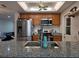 Well-equipped kitchen with stainless steel appliances and granite countertop at 9171 Vicksburg Rd, Spring Hill, FL 34608