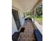 Comfortable porch with seating and beautiful outdoor views at 9171 Vicksburg Rd, Spring Hill, FL 34608