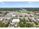 Expansive aerial view featuring commercial development and green landscape in a vibrant community setting at 9312 N Tampa St, Tampa, FL 33612