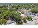 Lush residential area showing a neighborhood filled with mature trees and varied home styles from above at 9312 N Tampa St, Tampa, FL 33612