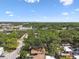 Scenic aerial perspective of a neighborhood with mature trees and glimpses of homes, capturing the area's charm at 9312 N Tampa St, Tampa, FL 33612