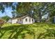 The home features a spacious backyard with mature trees, offering plenty of shade at 9312 N Tampa St, Tampa, FL 33612