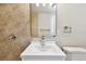 Bathroom featuring a vanity with sink, tiled wall and flooring, and a neutral color palette at 9312 N Tampa St, Tampa, FL 33612