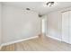 Bedroom with updated lighting, wood-look floors, and a closet at 9312 N Tampa St, Tampa, FL 33612