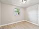 Bright bedroom featuring a window and fresh paint, offering a clean and inviting space at 9312 N Tampa St, Tampa, FL 33612