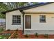 This charming home has a fresh exterior paint and well-landscaped front yard at 9312 N Tampa St, Tampa, FL 33612