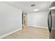 Bright living room featuring new flooring and fresh paint, offering a clean and modern aesthetic at 9312 N Tampa St, Tampa, FL 33612