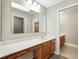 Bright bathroom featuring a vanity, makeup area, a big mirror and plenty of lighting at 9807 Stephenson Dr, New Port Richey, FL 34655