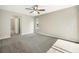 Bedroom with neutral carpet, a ceiling fan, and a window for natural light at 9807 Stephenson Dr, New Port Richey, FL 34655