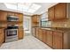 Well-lit kitchen with stainless steel appliances and granite countertops with tile backsplash at 9807 Stephenson Dr, New Port Richey, FL 34655