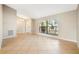 Bright living room featuring tiled floors, large windows, and neutral wall paint at 9807 Stephenson Dr, New Port Richey, FL 34655