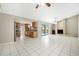 Open-concept space with kitchen, and living area featuring stainless appliances and stone fireplace at 9807 Stephenson Dr, New Port Richey, FL 34655