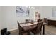 Traditional dining room features wood table, upholstered chairs, and decorative accents on a stylish table runner at 10361 Lightner Bridge Dr, Tampa, FL 33626