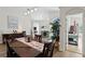 Elegant dining space featuring an open layout, wood flooring and stylish decor at 10361 Lightner Bridge Dr, Tampa, FL 33626