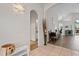 Bright foyer featuring tile flooring, arched doorways, and views of the home's open layout at 10361 Lightner Bridge Dr, Tampa, FL 33626
