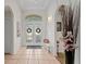 Welcoming foyer with tile floors, arched doorway and decorative elements, creating an inviting space at 10361 Lightner Bridge Dr, Tampa, FL 33626