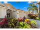 A well-manicured lawn with colorful plants enhances the appeal of this lovely home's entrance at 10361 Lightner Bridge Dr, Tampa, FL 33626