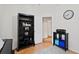 Home office featuring a black bookshelf, light walls, and wood-look flooring at 10361 Lightner Bridge Dr, Tampa, FL 33626